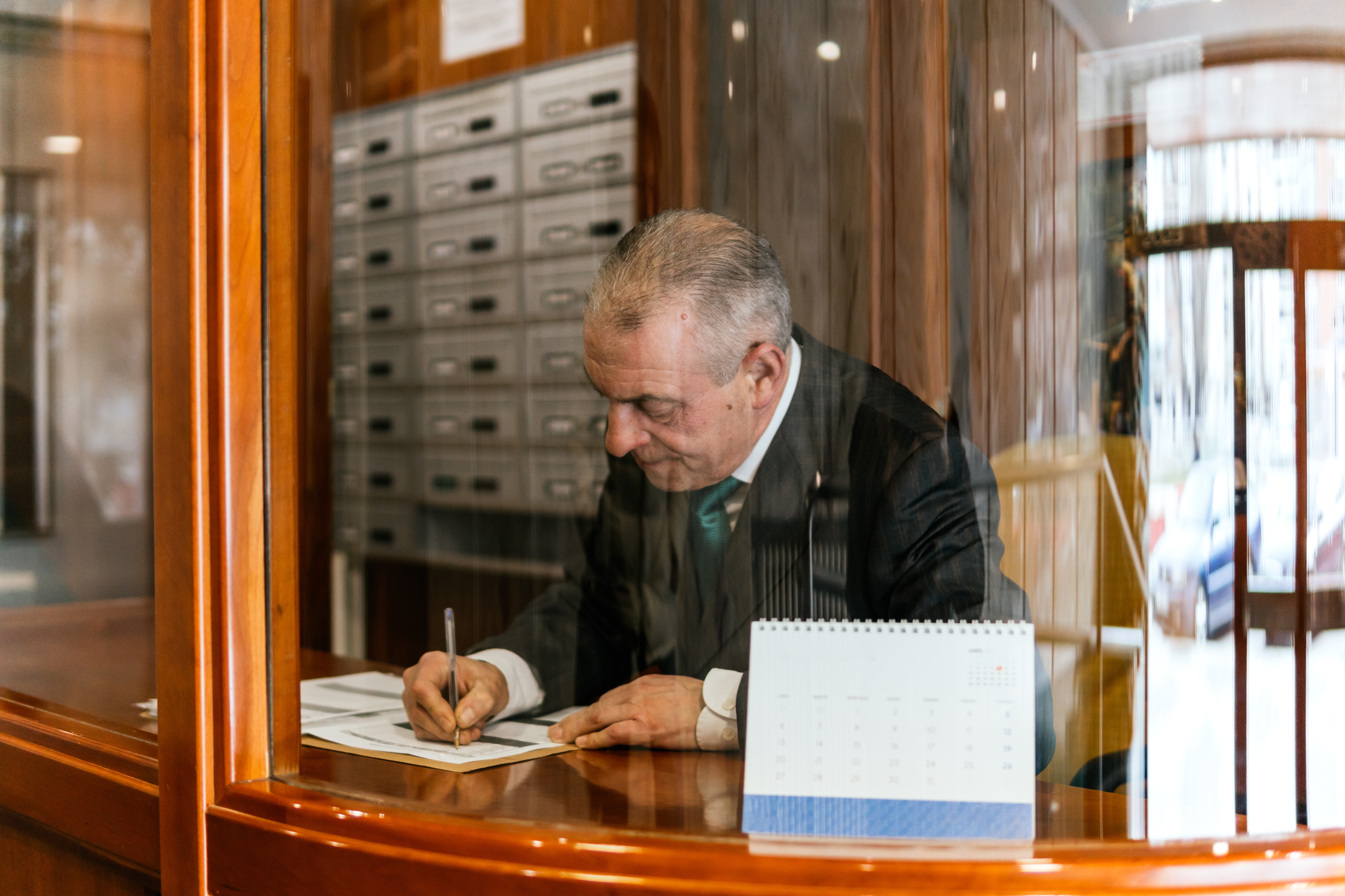 Concierge,Typing,In,The,Portal,Of,A,Building